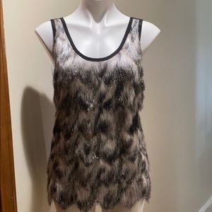 Be the hit of the party with this FUN top.